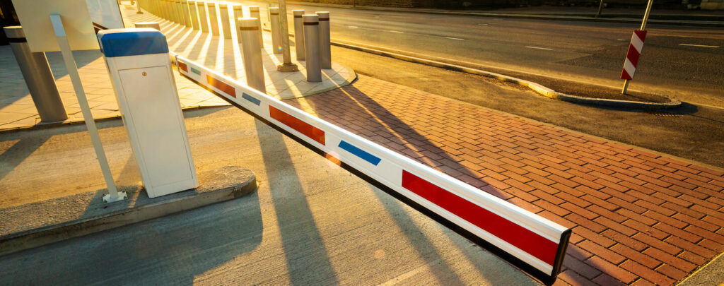 Close up of illuminated by warm sunset light barrier gate entrance